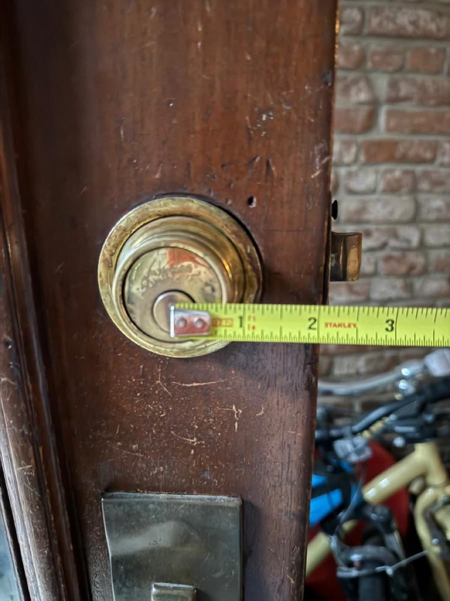 Measuring an antique mortise cylinder on a pre-war door
